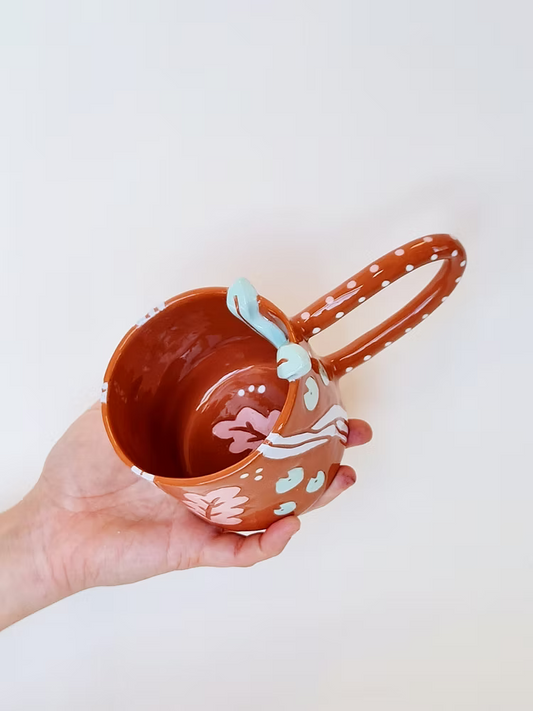 taza verde de ceramica