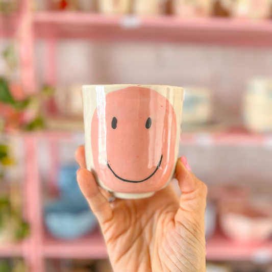 mug without handles happy face