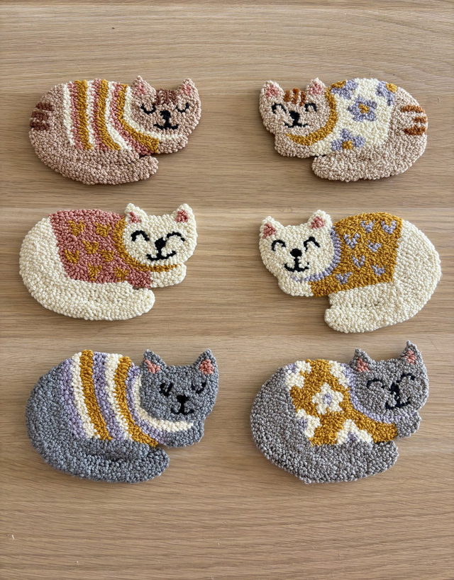 gato colgante pared